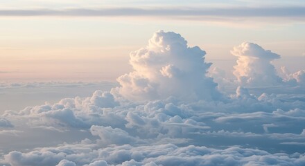 Aerial view of fluffy clouds illuminated by soft light in a serene atmosphere