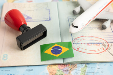 Approved Stamp passport with Brazil flag document to immigration at airport in country.
