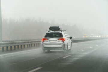 White station wagon with roof box