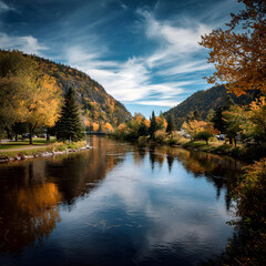 Calm river flowing through colorful autumn forest landscape