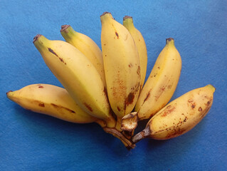 A bunch of ripe yellow bananas. Healthy tropical fruit cluster. Fresh organic natural diet food.