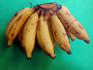 A bunch of ripe yellow bananas. Healthy tropical fruit cluster. Fresh organic natural diet food.
