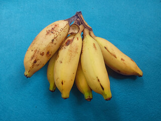 A bunch of ripe yellow bananas. Healthy tropical fruit cluster. Fresh organic natural diet food.