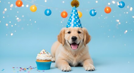 A happy golden retriever puppy wearing a blue polka dot party hat, lying down next to a festive cupcake with colorful sprinkles