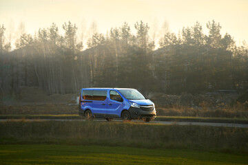 Fototapeta premium Commercial transport van traveling through nature