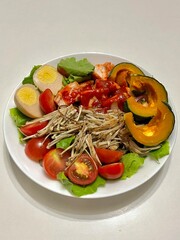 Fresh vegetable salad with a vibrant mix of greens, cherry tomatoes, cucumbers, and bell peppers. Crisp, colorful, and packed with vitamins, this salad makes a healthy, delicious meal or side.