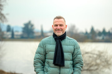 Man Smiling By Lakeside Path