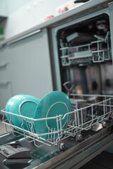 Loading dishwaher. Daily chores concept.