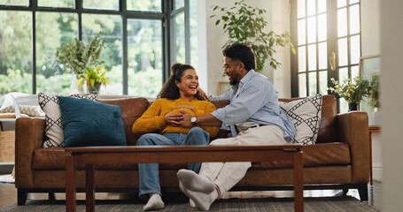 Obraz premium Happy couple, relax and sofa with baby bump for pregnancy, new chapter or start family in home. Man, pregnant woman and smile with love in living room for parenthood or maternity on couch in house