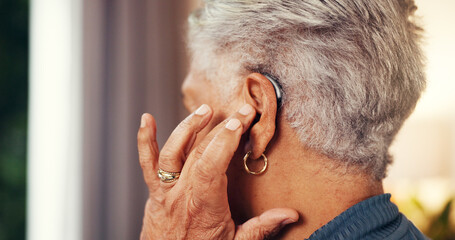 House, back and senior woman with hearing aid, testing and fitting mould with retirement. Hand, pensioner and elderly person with disability, medical audio tech and deaf with technology and support