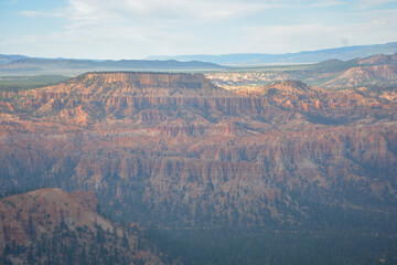 Family hiking in red mountains in Utah on summer vacation. Friends hiking Fairyland Loop Trail . Bryce Canyon National Park, Utah, USA.