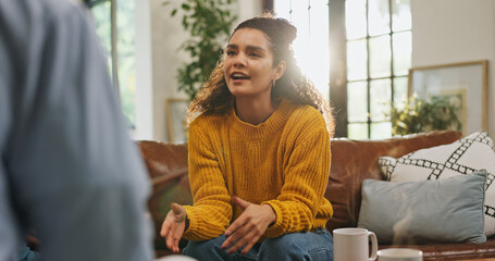 Therapy, talking and woman on sofa for counseling, session and support for healing with therapist....