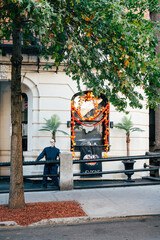 Halloween decorations enhance autumn ambiance in Harlem with spooky character and foliage