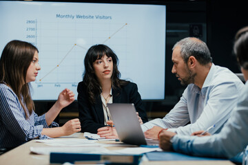 Business executives discussing startup investment losses in boardroom meeting