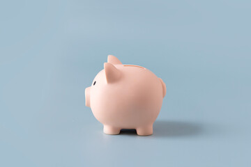 One piggybank on blue background.