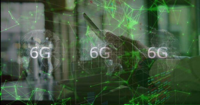 Professional using tablet in office with holographic world map, 6G network and monitors, copy space