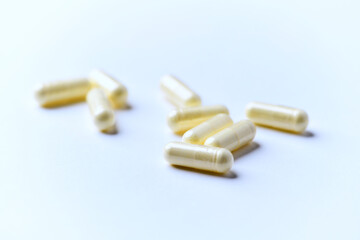 Alpha-lipoic acid capsules. Paper background. Soft focus. Close up. Copy space.	
