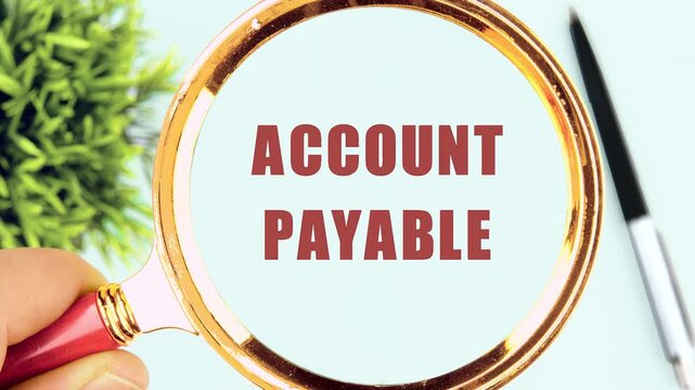 Magnifying glass showing the words Accounts Payable. Financial Concept.
