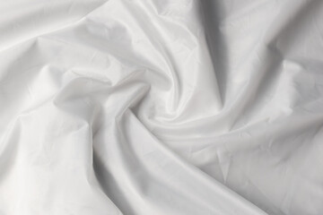 White background texture. White rippled fabric with waves.