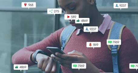 Woman glancing smartwatch, tapping smartphone as social media icons multiplying around her - Powered by Adobe