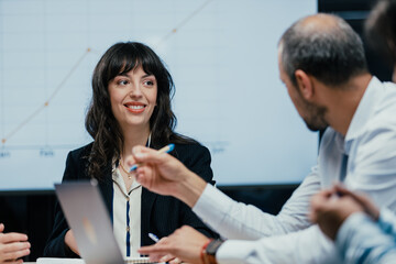 Happy female executive celebrating successful client deal and financial achievement closeup