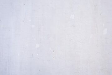 Fototapeta premium A close up of a white wall with some minor imperfections and subtle color variations across the surface