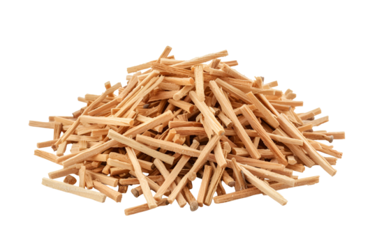 Pile of small light brown wooden sticks on black background