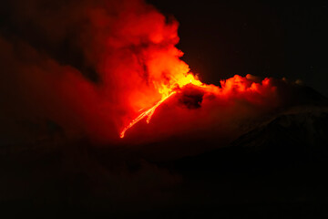 eruption of volcano during night ,  Night sky fire explosion burst flame smoke burning light glow...