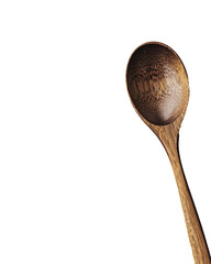 Wooden spoon with intricate design on a dark background