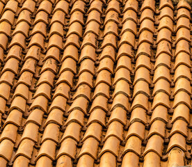 orange and brown old tile roof texture background. Old vintage roof tiles backdrop for concept and...