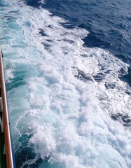 Foamy waves alongside a ship
