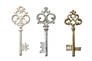 Three ornate antique keys in white silver and gold