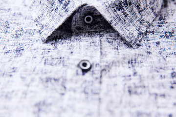 Close up of men's linen shirt. Soft focus.	