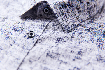 Close up of men's linen shirt. Soft focus.	