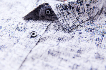 Close up of men's linen shirt. Soft focus.	