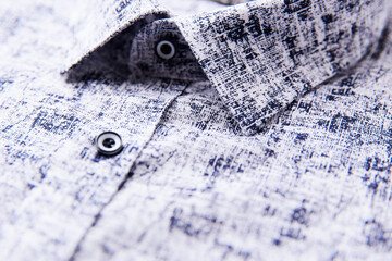Close up of men's linen shirt. Soft focus.	