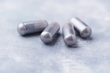 BCAA amino acids tablets. Nutrition for bodybuilding. Fitness supplements on bright background. Soft focus. Copy space.	