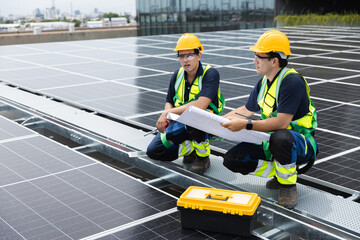 Team technicians and engineers working installing and inspection standards of solar panels on roof...