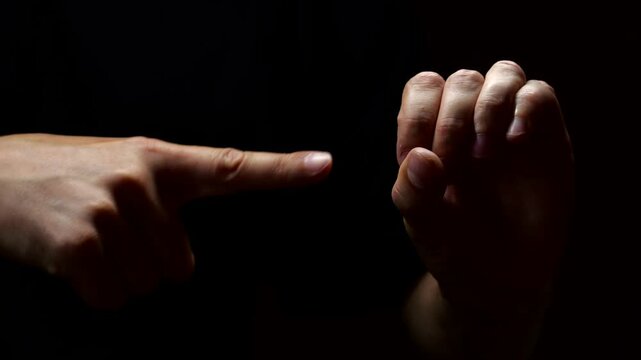 Sex sign on a black background.
The hands of an adult man show a sexual gesture with his hands.
Imitation of sex on a black background.
Sex, love, excitement, intimacy