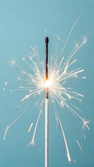 A single sparkler burns brightly against a soft blue background, creating a festive and celebratory atmosphere