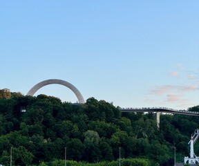 Arch of Friendship of Nations and walking bridge view of Kyiv, Ukraine
