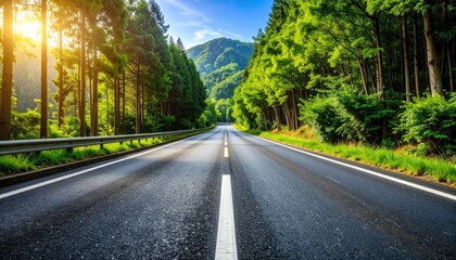 Obraz premium Scenic highway through lush green forest at sunrise