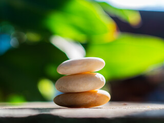 Spa stone on blur green leaf background zen salon beauty card meditation balance nature massage...