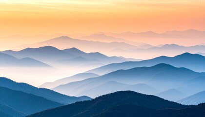 Obraz premium A serene blue mountain landscape emerges from the morning mist, with the sun rising over cloudy peaks and a misty forest view