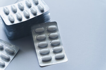 Medicine pill in blister packaging used in pharmacy and health care. Ideal of drug treatment, supplement or vitamin and pharmaceutical marketing. Healthcare and illness concept.