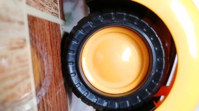 Car wheel spinning. Black tire with yellow rim rolling slowly. Best intro clip for racing, car presentation, branding, rally competition etc