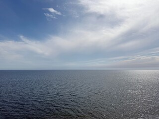 Open sea endless waters and cloudy sky.