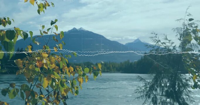 On start river holding steady near autumnal trees and mountains while waveform pulsing for audio