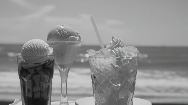Several refreshing beverages and ice cream treats served on a beachside patio.