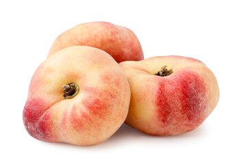 Ripe flat peaches close-up on a white. Isolated